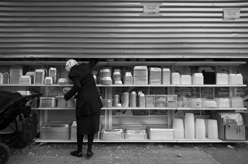 Women picking Food Container/Penn Street, Brooklyn, NY